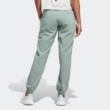 ADIDAS SPORTSWEAR Tapered Workout Pants in Green