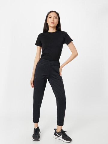 UNDER ARMOUR Tapered Sports trousers 'Meridian' in Black