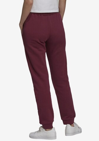 Effilé Pantalon ADIDAS ORIGINALS en rouge