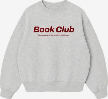 Onirique Bluzka sportowa 'Book Club' w kolorze szary: przód
