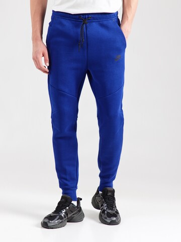Nike Sportswear Конический (Tapered) Штаны 'TCH FLC' в Синий: спереди