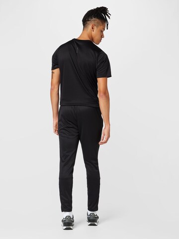 PUMA Tapered Sportbroek in Zwart