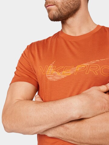 NIKE Functioneel shirt 'Pro' in Oranje