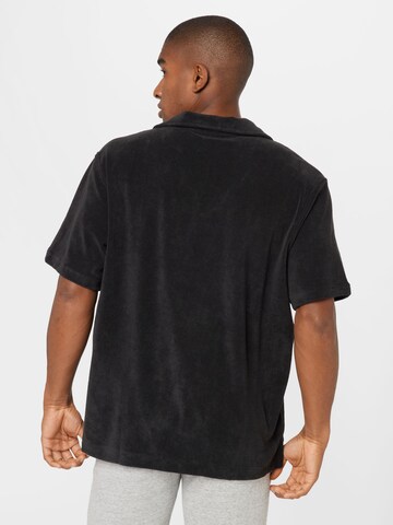 WEEKDAY - Camiseta 'Troy' en negro