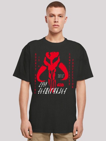 F4NT4STIC Shirt 'Star Wars The Mandalorian Complicated Profession' in Zwart: voorkant