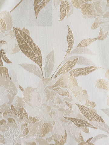 Vestă de la Next pe bej