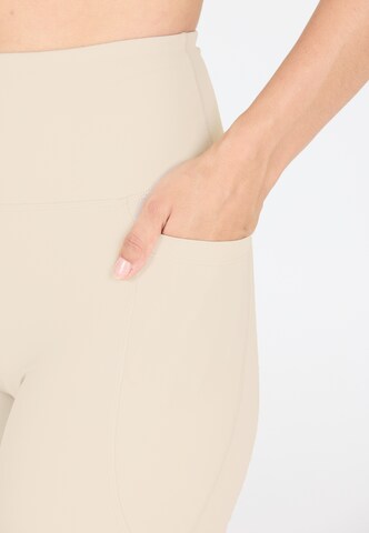 Athlecia Regular Workout Pants 'Aliya' in Beige