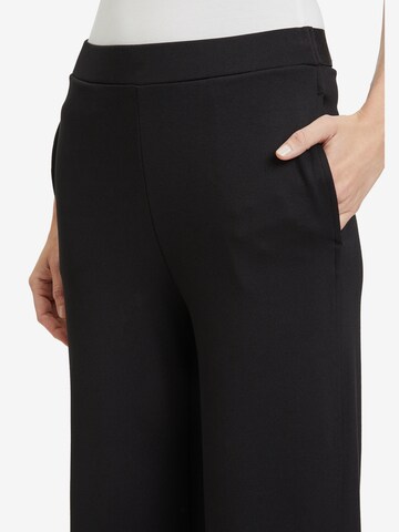 Wide leg Pantaloni di Cartoon in nero