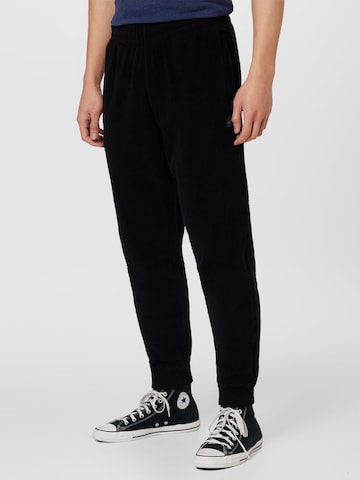 Superdry Tapered Trousers in Black: front