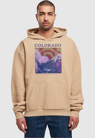 Merchcode Sweatshirt 'Peanuts - Colorado' in Beige: voorkant