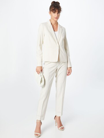 Weekend Max Mara Tapered Pressveckad byxa i beige