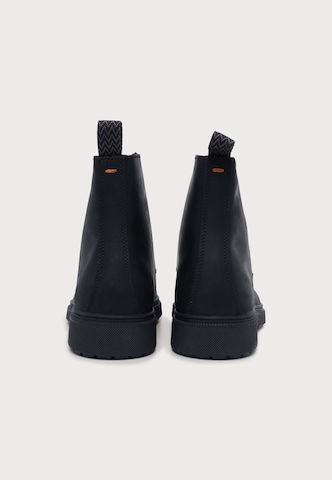 BOSS - Botas con cordones 'Ferling' en negro: atrás