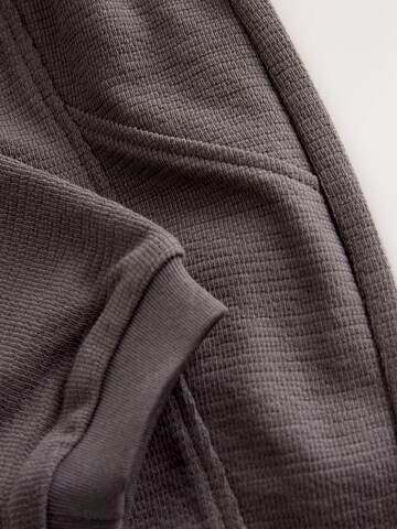 Next Tapered Housut värissä beige