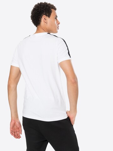 T-Shirt 'Iconic T7' PUMA en blanc