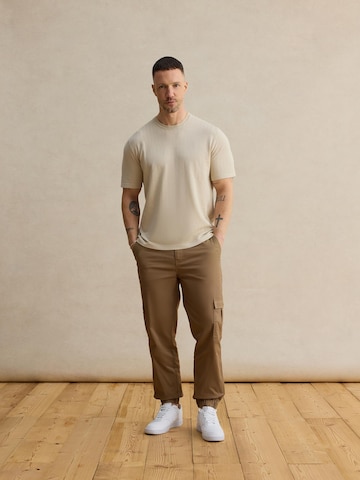DAN FOX APPAREL Tapered Trousers 'Damon' in Beige