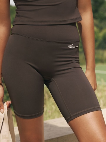 self. Skinny Shorts in Braun