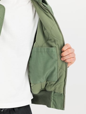 ALPHA INDUSTRIES Between-Season Jacket 'Cvc Modiry' in Green: side