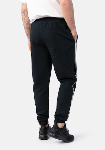 Effilé Pantalon de sport Hero en bleu
