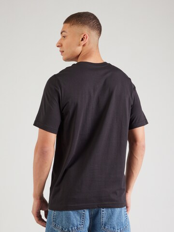 PUMA - Camisa 'Ess' em preto