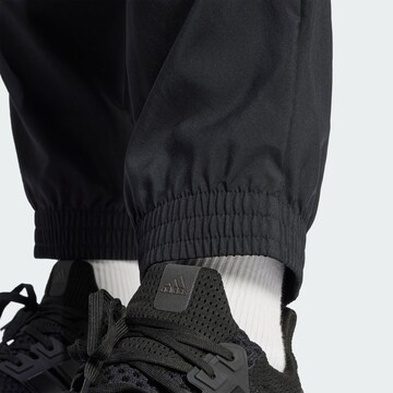 ADIDAS SPORTSWEAR Tapered Sports trousers 'Essentials' in Black