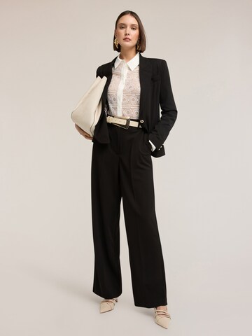 Wide leg Pantaloni di MOTIVI in nero