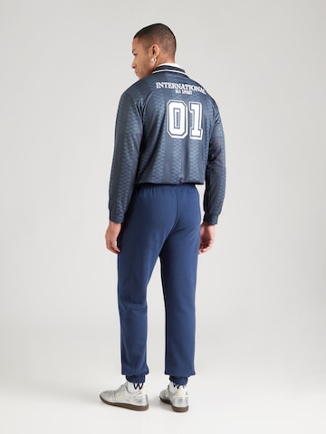 ELLESSE - Tapered Pantalón 'Orvinio' en azul