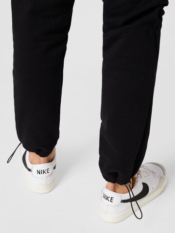 Kosta Williams x About You Regular Trousers in Black
