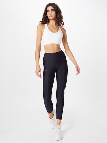 UNDER ARMOUR Skinny Sports trousers in Black
