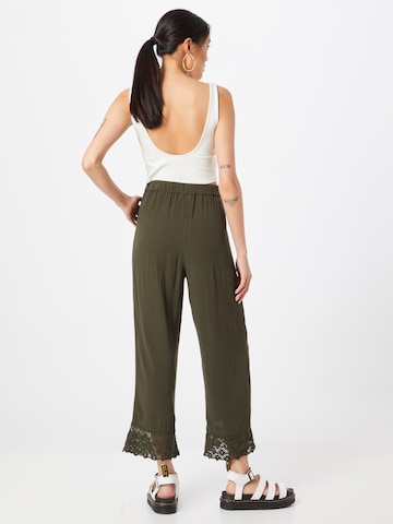 ABOUT YOU Loose fit Trousers 'Carlene' in Green