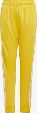 ADIDAS ORIGINALS Tapered Pants 'Adicolor SST' in Yellow: front