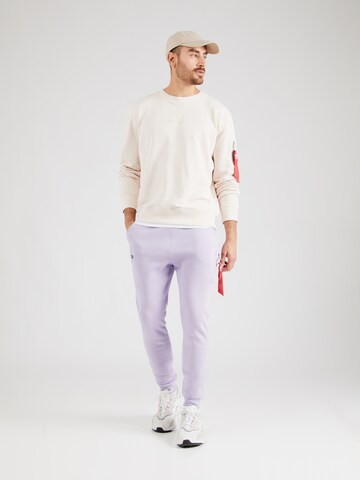 Tapered Pantaloni 'NASA' di ALPHA INDUSTRIES in lilla