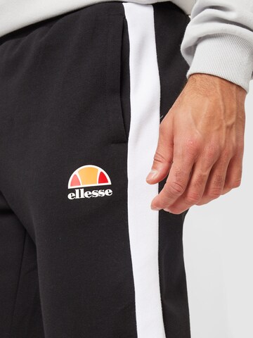 ELLESSE Zúžený Sportovní kalhoty – černá