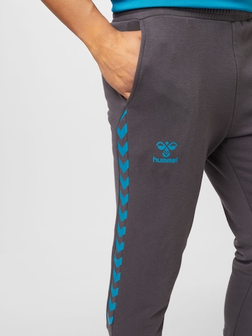 Hummel Ozke Športne hlače 'Staltic' | siva barva