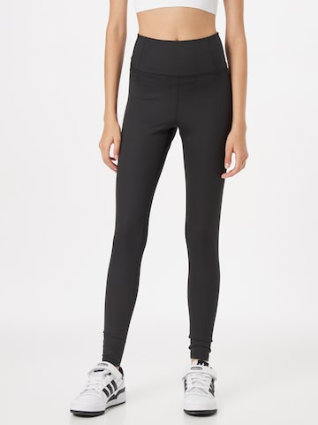 Girlfriend Collective Skinny Workout Pants in Black: front