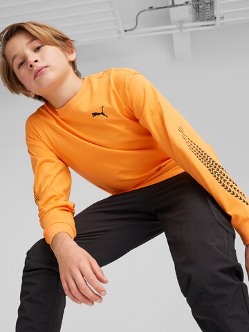 PUMA Shirt 'CLASSICS XCOUNTRY BIKER' in Orange: front