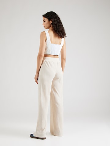 Loosefit Pantaloni 'Emina' di ABOUT YOU in beige