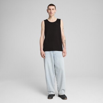 PUMA Funktionsshirt 'Essentials' in Schwarz