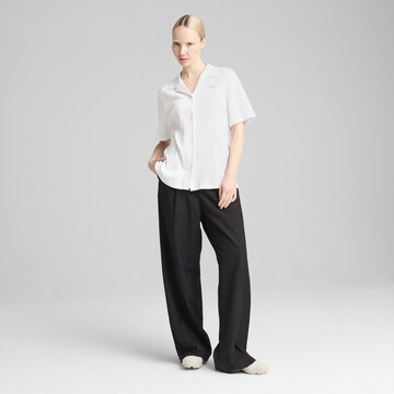 PUMA Blouse 'Wardrobe Ess' in Wit