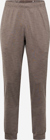 NIKE Workout Pants in Beige: front