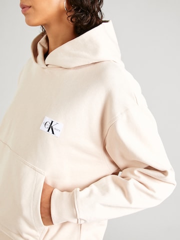 Sweat-shirt 'Badge' Calvin Klein Jeans en beige