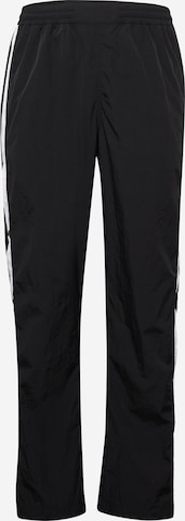 Tommy Jeans Loose fit Trousers in Black: front