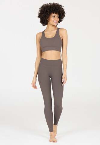 Athlecia Skinny Sportbroek 'Luxe' in Bruin