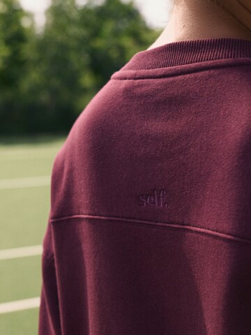 Sweat-shirt self. en rouge
