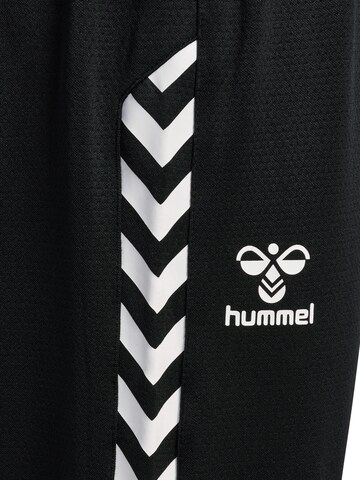 Effilé Pantalon de sport Hummel en noir