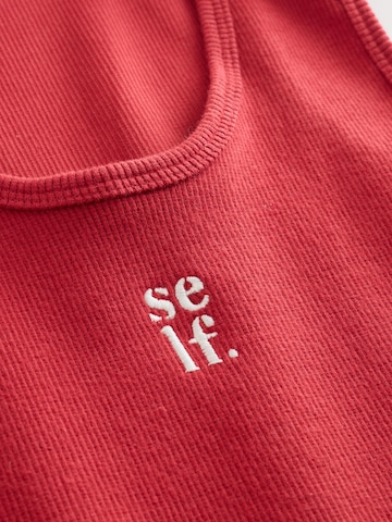 Top di self. in rosso