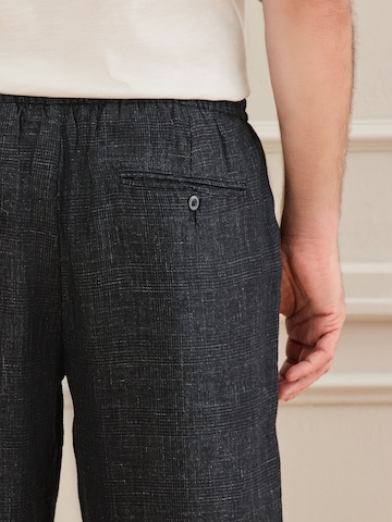 Loosefit Pantalon chino 'Signature Heritage' Next en noir