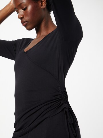 CURARE Yogawear Shirt in Schwarz