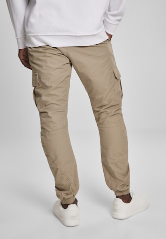 Tapered Pantaloni cargo di Urban Classics in beige