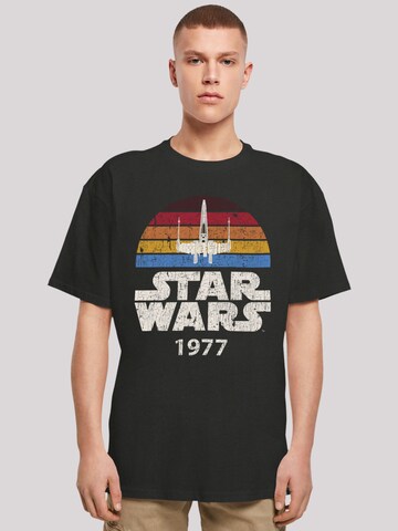 F4NT4STIC T-Shirt 'Star Wars X-Wing Trip 1977 T' in Schwarz: predná strana