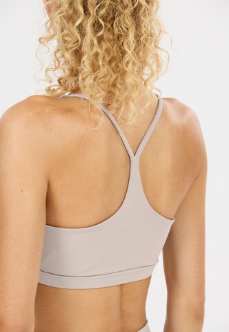 Athlecia Low Support Sport-BH 'Blossom' in Grau